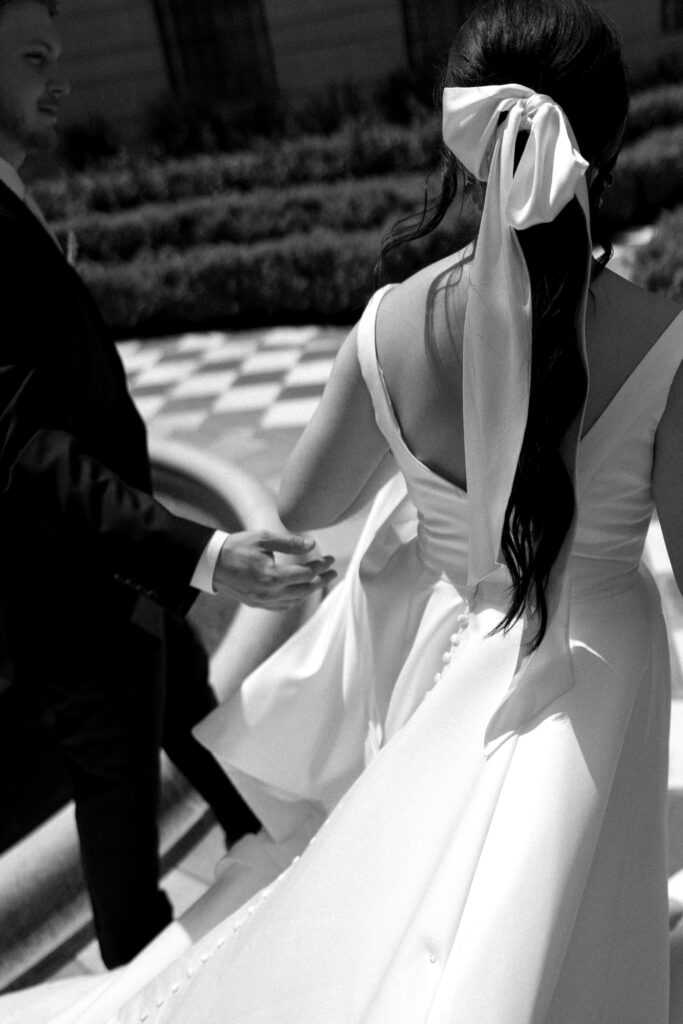 Bride and Groom take bridal portraits outside the nebraska capitol building 