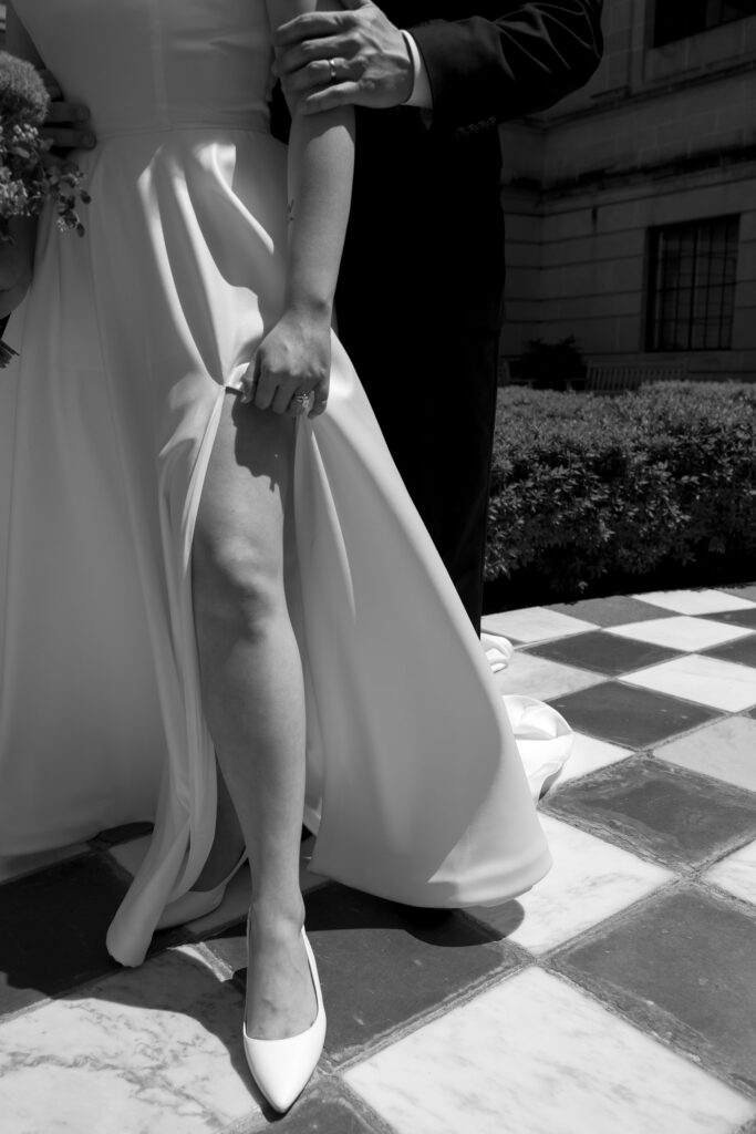 Bride and Groom take bridal portraits outside the nebraska capitol building 