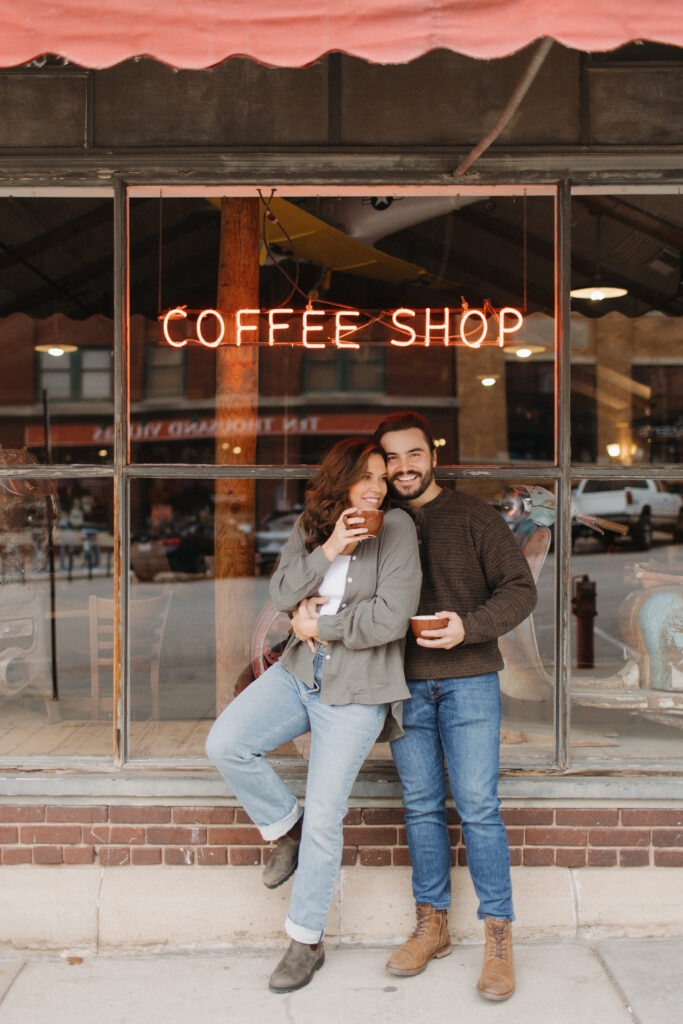 outdoor engagement pictures at a coffee shop in downtown lincoln nebraska