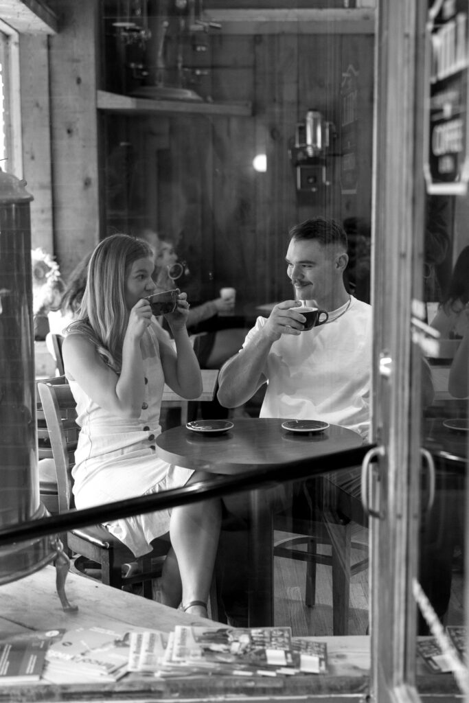 outdoor engagement pictures at a coffee shop in downtown lincoln nebraska