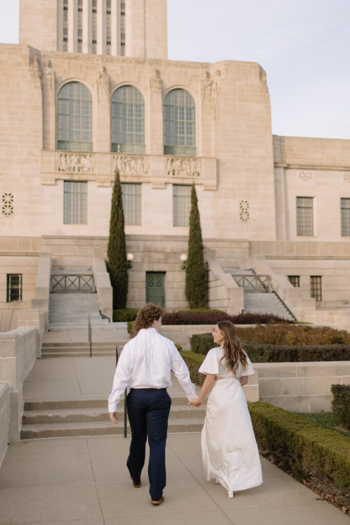 outdoor engagement photos at the Nebraska state capitol building downtown lincoln 