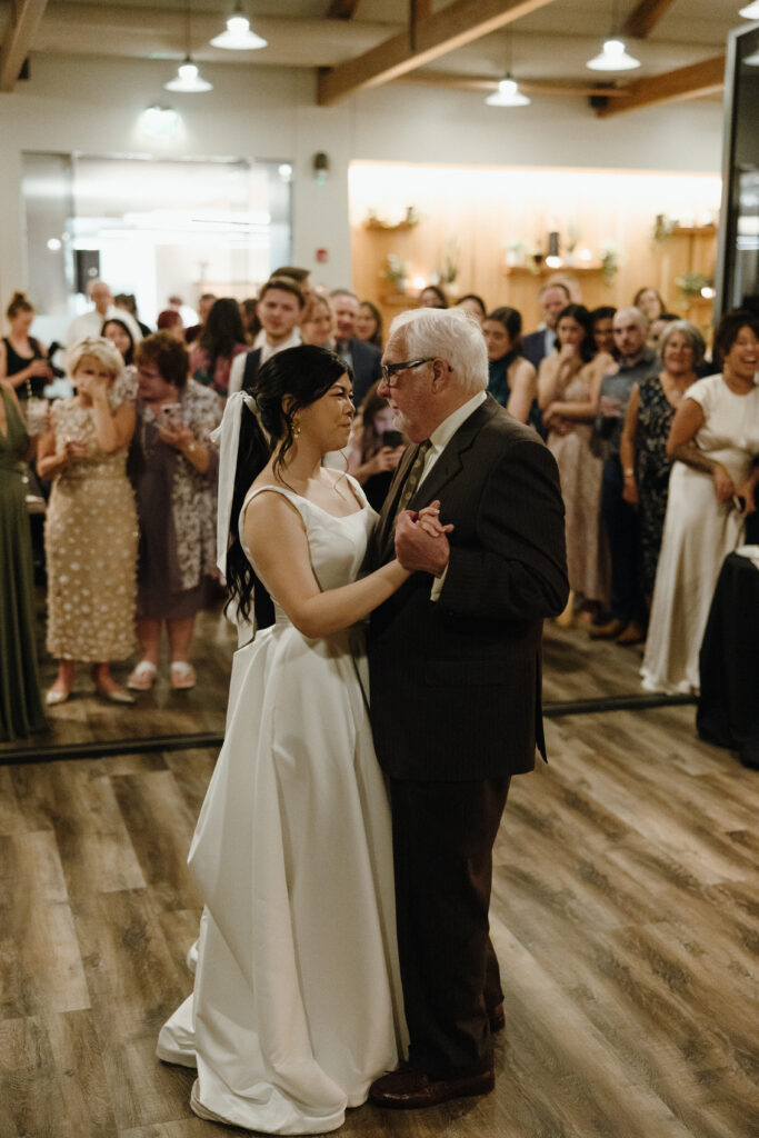 bride and her father dance during an intimate wedding reception