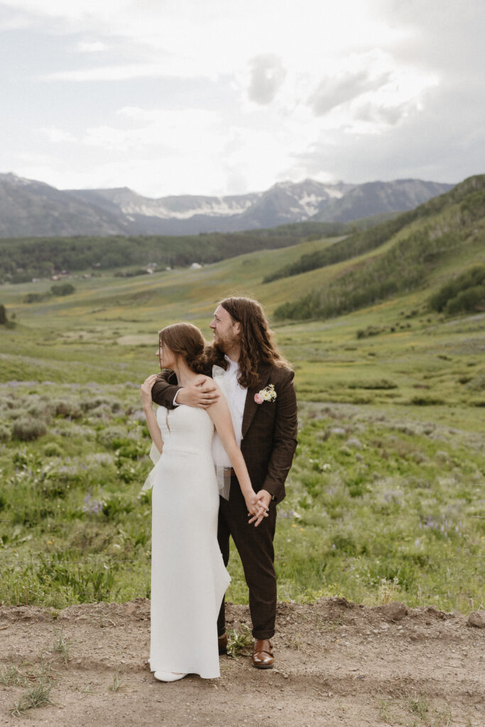 bride and groom take portraits after their intimate wedding in colorado 