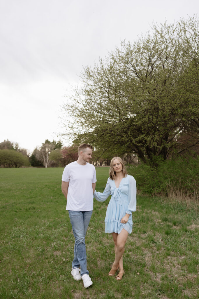 A casual summer dress like this blue one is a great option to wear for engagement photos 