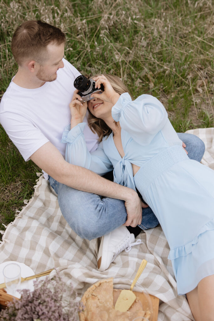 summer engagement pictures in a cute and flowy blue dress