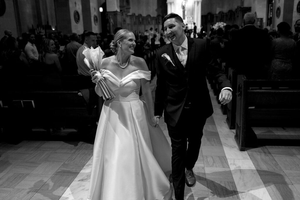 bride and groom walk back down the aisle 