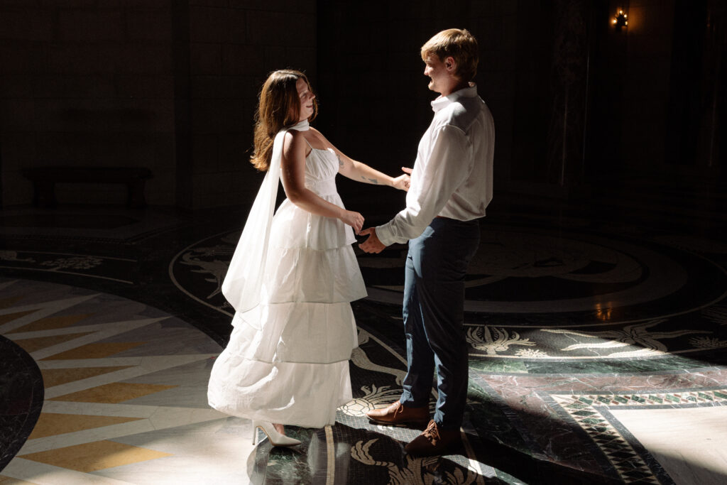 A beautiful white dress and white heels is a great example of what to wear for engagement photos 