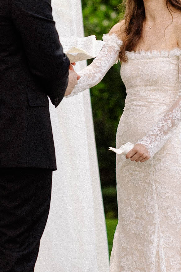 couple holding vows during wedding ceremony