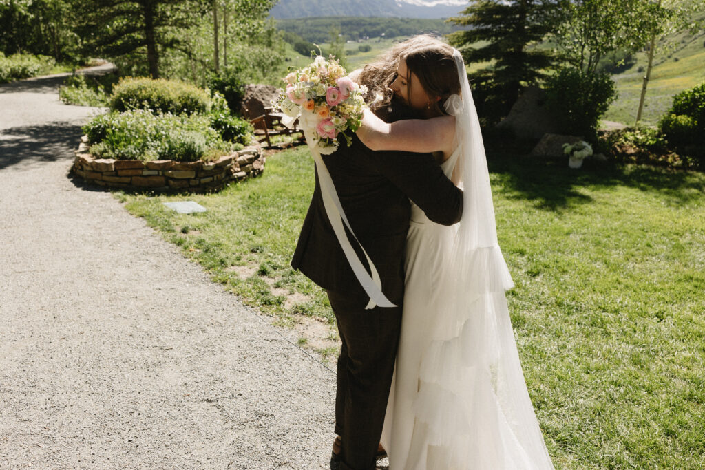 bride and groom hug after their wedding ceremony