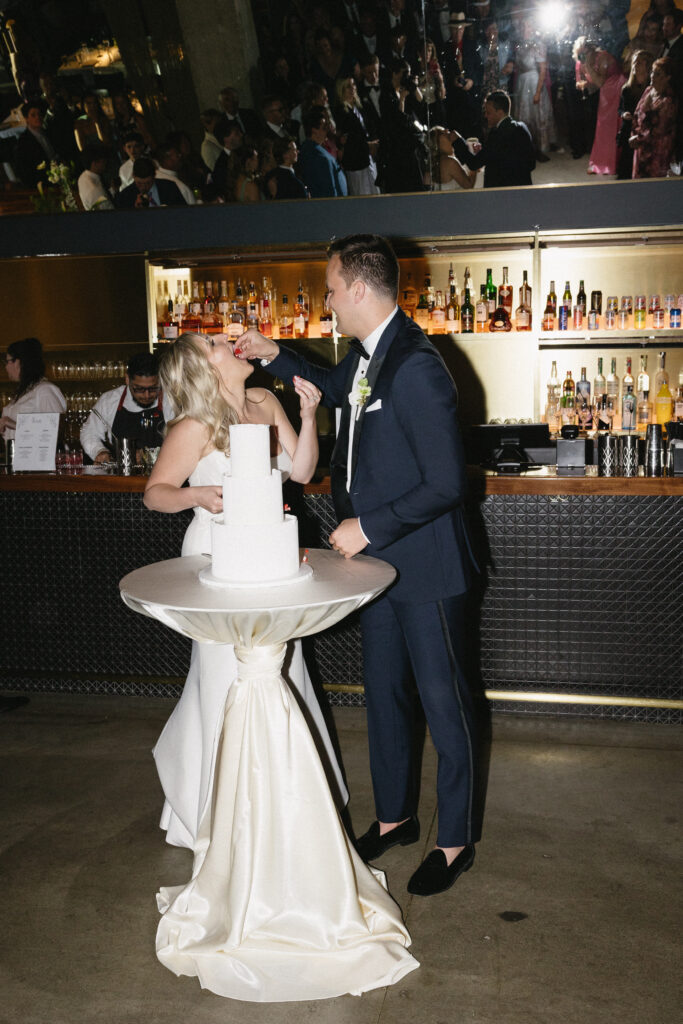 bride and groom cut the cake 