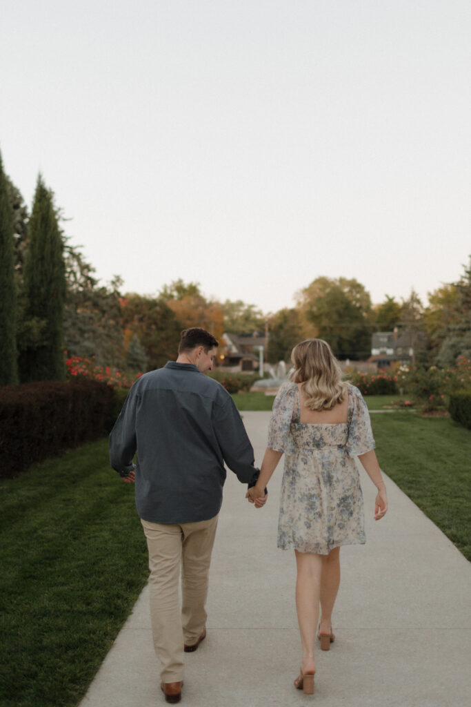 dahn and paige walk hand in hand at memorial park