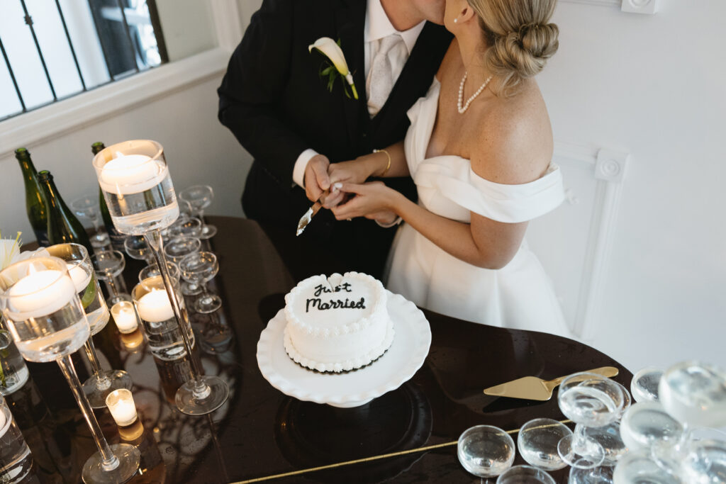 bride and groom share a private cake cutting at the empire room wedding 