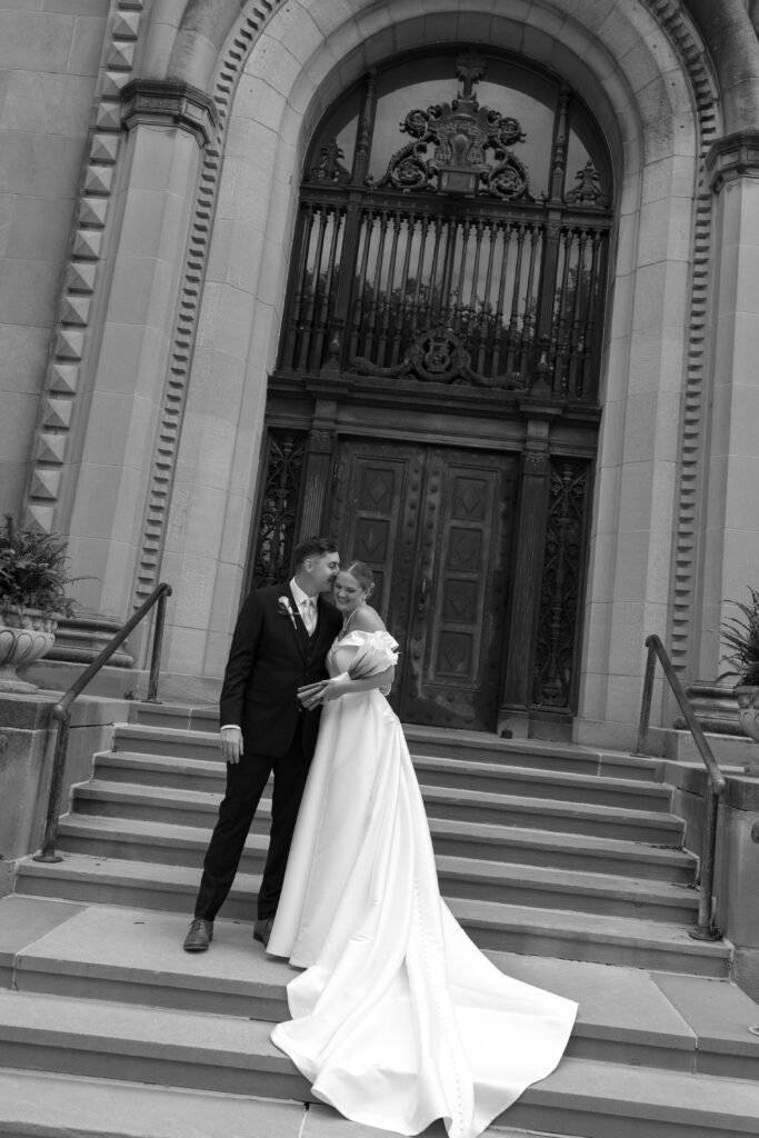 bride and groom outside of the cathedral in omaha nebraska 