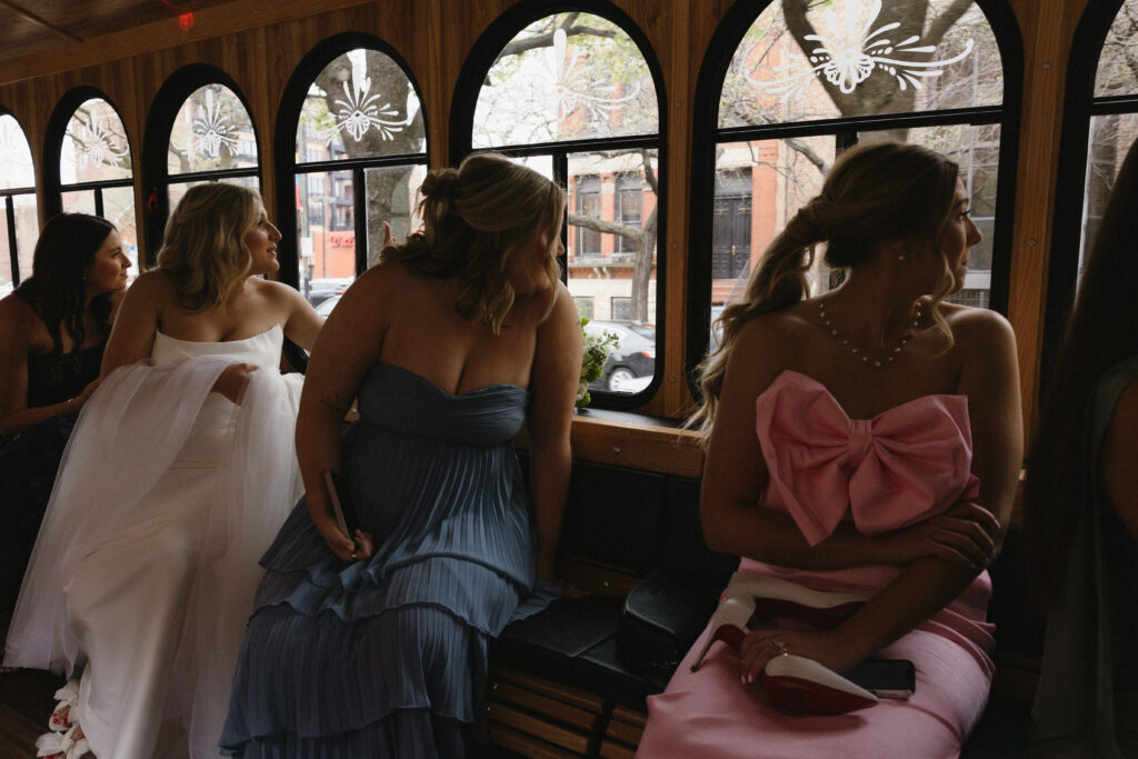 the bridesmaids and bride on the way to the catholic ceremony at saint clements 