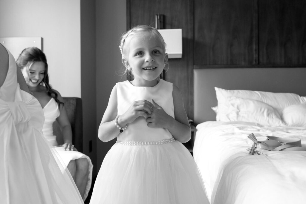 flower girl gets ready with bride 