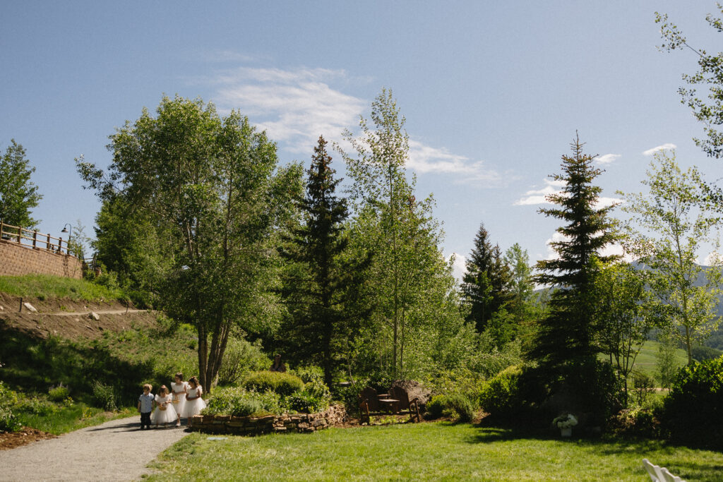flower children walking down the aisle 