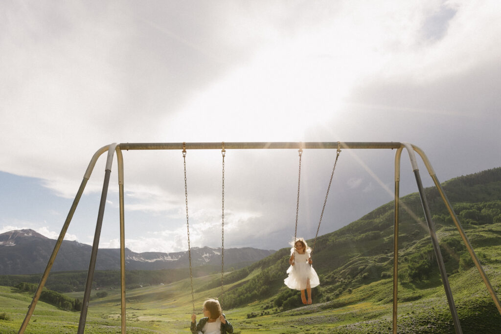 flower girls swing at the reception 