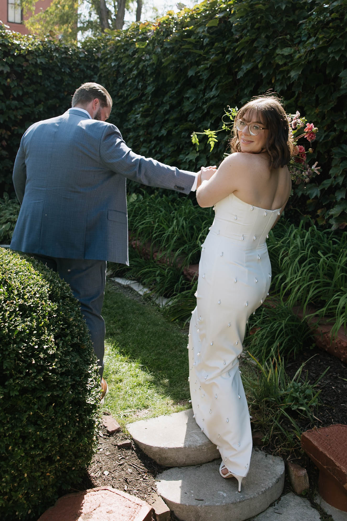 bride and groom walking through Lucile’s Old Market wedding venue