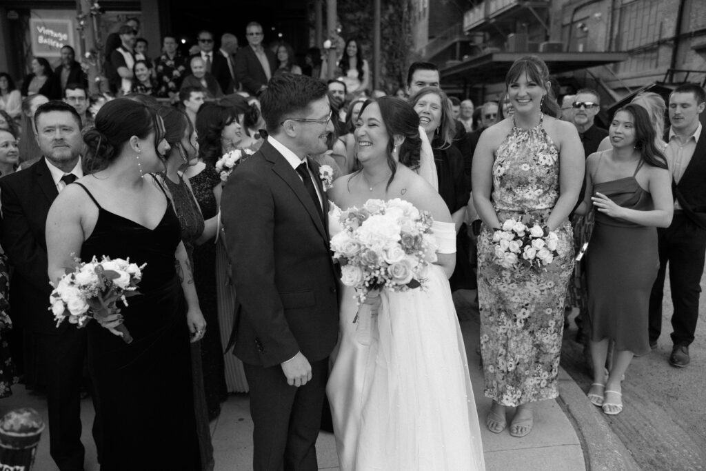 guests gather outside after a vintage ballroom wedding 