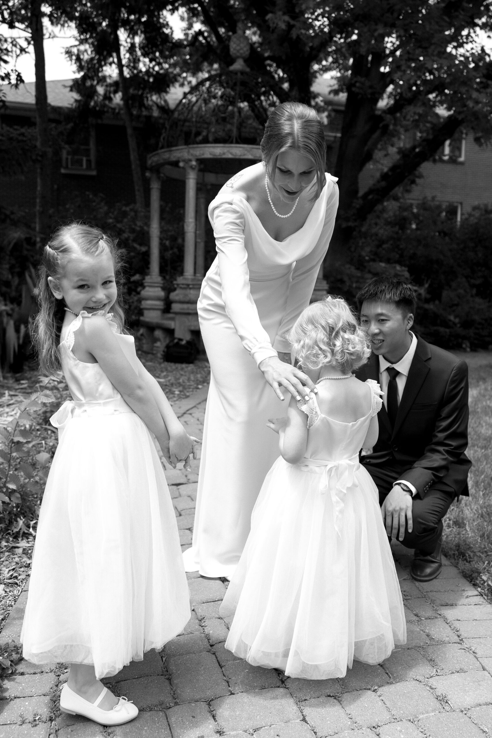 Flower girls with bride and groom on wedding day